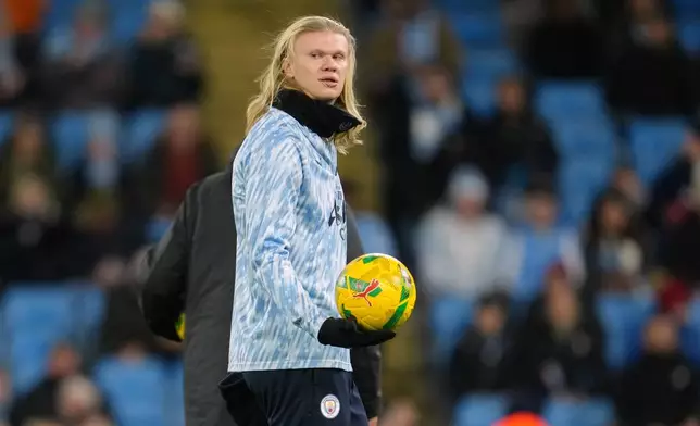 Manchester City's Erling Haaland warms up before the English League Cup soccer match between Manchester City and Brentford n Manchester, England, Wednesday, Dec. 17, 2025. (AP Photo/Jon Super)