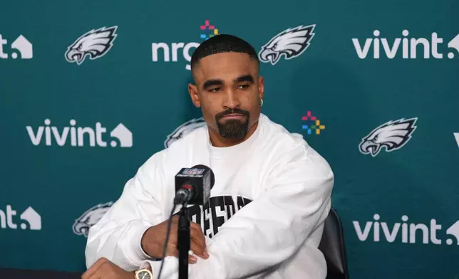 Philadelphia Eagles quarterback Jalen Hurts talks to the media during a news conference following an NFL football game, Saturday, Dec. 20, 2025, in Landover, Md. (AP Photo/Stephanie Scarbrough)