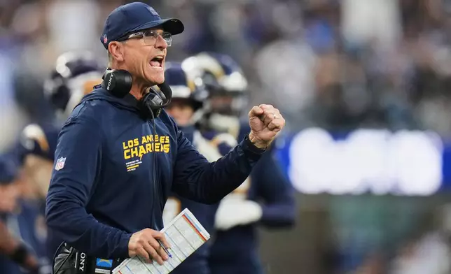 Los Angeles Chargers head coach Jim Harbaugh reacts on the sideline during the second half of an NFL football game against the Las Vegas Raiders, Sunday, Nov. 30, 2025, in Inglewood, Calif. (AP Photo/Jae C. Hong)