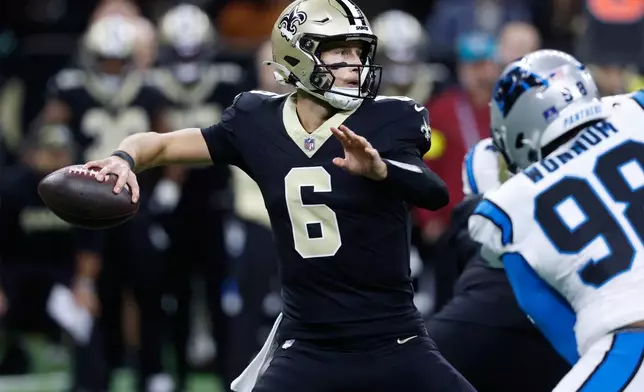 New Orleans Saints quarterback Tyler Shough (6) throws a pass in the first half of an NFL football game against the Carolina Panthers, Sunday, Dec. 14, 2025, in New Orleans. (AP Photo/Butch Dill)