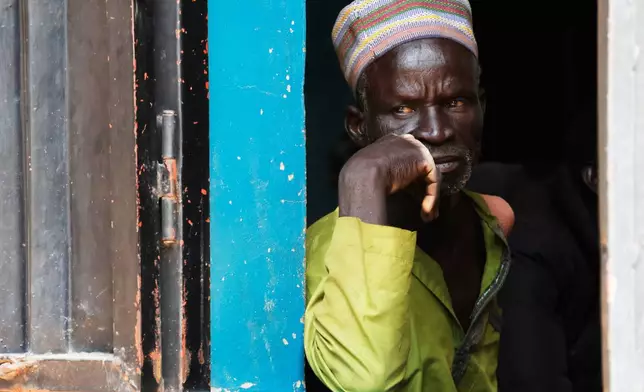 A worried parent of abducted school children looks on at St. Mary's Catholic Primary and Secondary School in Papiri community, Nigeria, Friday, Nov. 28, 2025. (AP Photo )