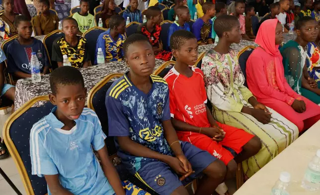 Freed students of the St. Mary's Catholic School in the Papiri community upon arrival at the government house in Minna, Nigeria, Monday, Dec. 8, 2025. (AP Photo)