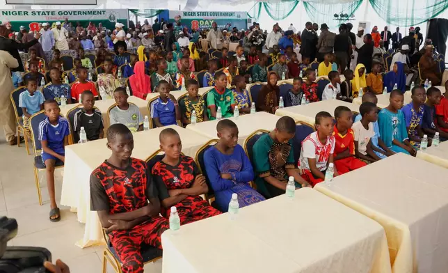 Freed students of the St. Mary's Catholic School in the Papiri community upon arrival at the government house in Minna, Nigeria, Monday, Dec. 8, 2025. (AP Photo)