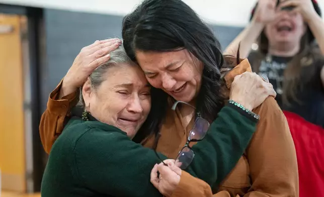 People celebrate after passage of the National Defense Authorization Act by the U.S. Senate, during a watch party hosted by the Lumbee Tribe of North Carolina, Wednesday, Dec. 17, 2025, in Pembroke, N.C. (AP Photo/Allison Joyce)