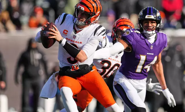 Cincinnati Bengals quarterback Joe Burrow (9) scrambles during the first half of an NFL football game against the Baltimore Ravens, Sunday, Dec. 14, 2025, in Cincinnati. (AP Photo/Jeff Dean)