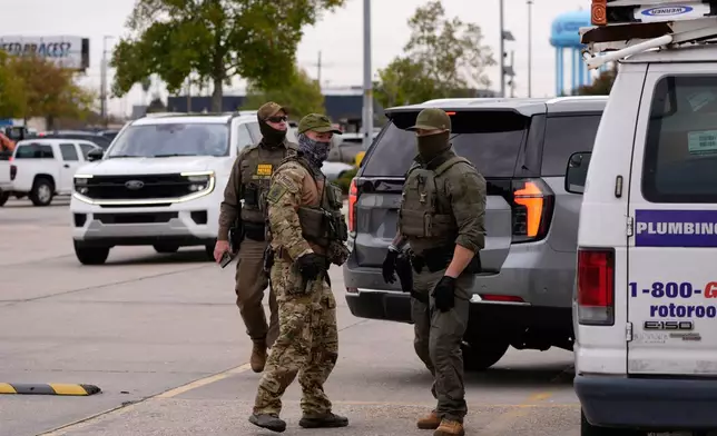 U.S. Border Patrol agents arrive at a Home Depot in Kenner, La.,Wednesday, Dec. 3, 2025. (AP Photo/Gerald Herbert)
