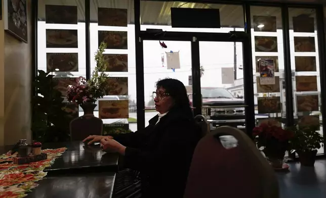 Carmela Diaz speaks inside her closed restaurant in the midst of a Customs and Border Protection immigration crackdown in Kenner, La., Thursday, Dec. 4, 2025. (AP Photo/Gerald Herbert)