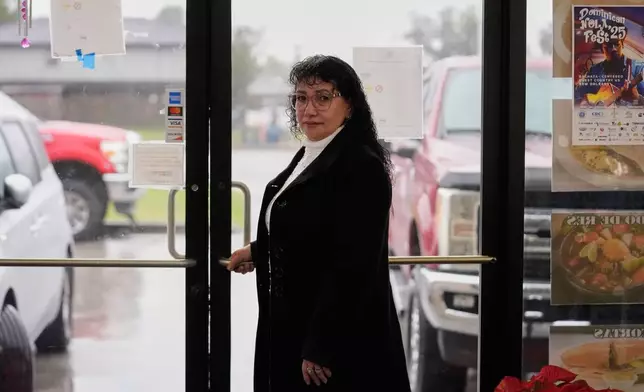 Carmela Diaz poses inside her closed restaurant in the midst of a Customs and Border Protection immigration crackdown in Kenner, La., Thursday, Dec. 4, 2025. (AP Photo/Gerald Herbert)