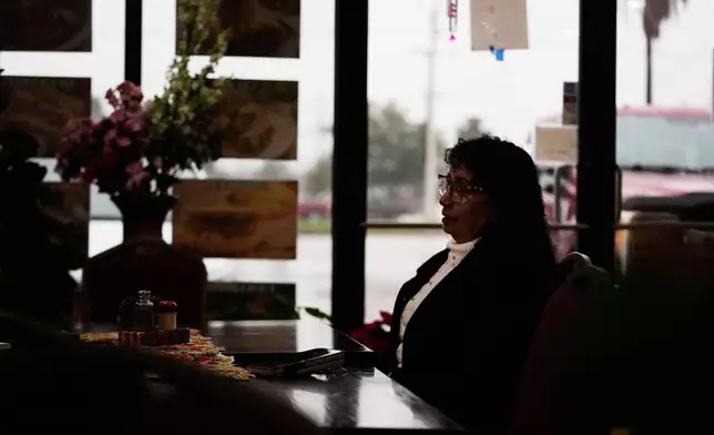 Carmela Diaz speaks inside her closed restaurant in the midst of a Customs and Border Protection immigration crackdown in Kenner, La., Thursday, Dec. 4, 2025. (AP Photo/Gerald Herbert)