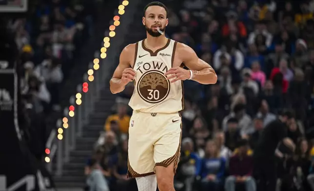 Golden State Warriors guard Stephen Curry looks on during the first half of an NBA basketball game against the Orlando Magic, Monday, Dec. 22, 2025, in San Francisco (AP Photo/Justine Willard)