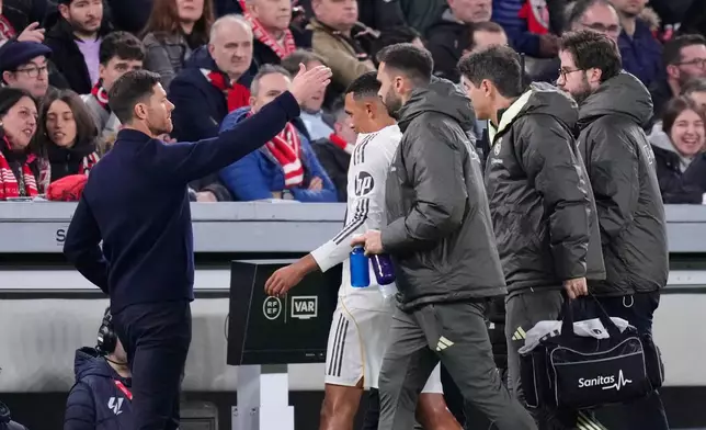 Real Madrid's Trent Alexander-Arnold, centre, walks off after being injured during the Spanish La Liga soccer match between Athletic Bilbao and Real Madrid in Bilbao, Spain, Wednesday, Dec. 3, 2025. (AP Photo/Jose Breton)