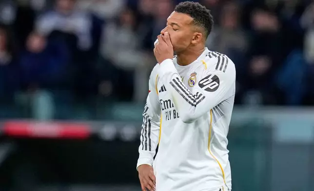 Real Madrid's Kylian Mbappe reacts during the Spanish La Liga soccer match between Real Madrid and Celta Vigo in Madrid, Spain, Sunday, Dec. 7, 2025. (AP Photo/Manu Fernandez)