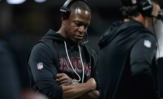 Atlanta Falcons head coach Raheem Morris looks down on the sideline as his team trails against the Seattle Seahawks during the second half of an NFL football game, Sunday, Dec. 7, 2025, in Atlanta. (AP Photo/Brynn Anderson)