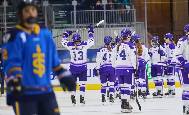 The Minnesota Frost celebrate their win against the Toronto Sceptres in PWHL hockey action in Toronto, Tuesday, Dec. 30, 2025. (Sammy Kogan/The Canadian Press via AP)