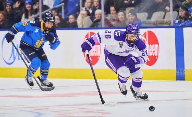 Minnesota Frost's Kendall Coyne Schofield (26) sprints past Toronto Sceptres' Savannah Harmon (15) to score a breakaway empty net goal during third period PWHL hockey action in Toronto, Tuesday, Dec. 30, 2025. (Sammy Kogan/The Canadian Press via AP)