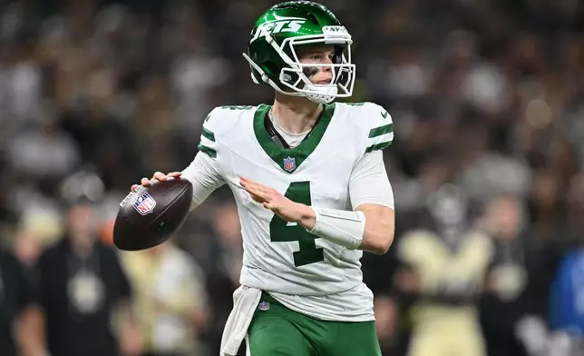 New York Jets quarterback Brady Cook throws during the second half of an NFL football game against the New Orleans Saints, Sunday, Dec. 21, 2025, in New Orleans. (AP Photo/Ella Hall)