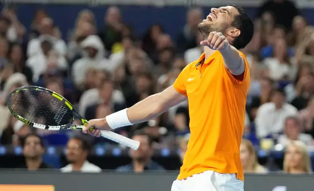 Carlos Alcaraz reacts after winning the first set against Joao Fonseca during the Miami Tennis Invitational tournament, Monday, Dec. 8, 2025, in Miami. (AP Photo/Lynne Sladky)