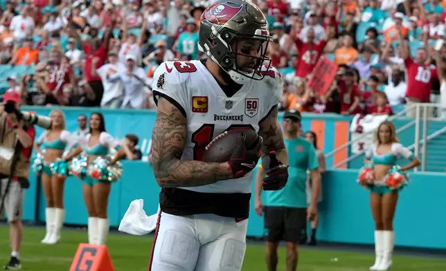 Tampa Bay Buccaneers wide receiver Mike Evans (13) makes a catch for a touchdown against the Miami Dolphins during the second half of an NFL football game Sunday, Dec. 28, 2025, in Miami Gardens, Fla. (AP Photo/Lynne Sladky)