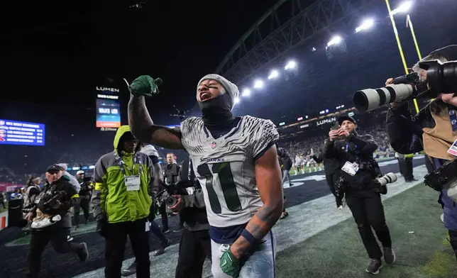 Seattle Seahawks wide receiver Jaxon Smith-Njigba reacts after an NFL football game against the Los Angeles Rams, Thursday, Dec. 18, 2025, in Seattle. (AP Photo/Lindsey Wasson)