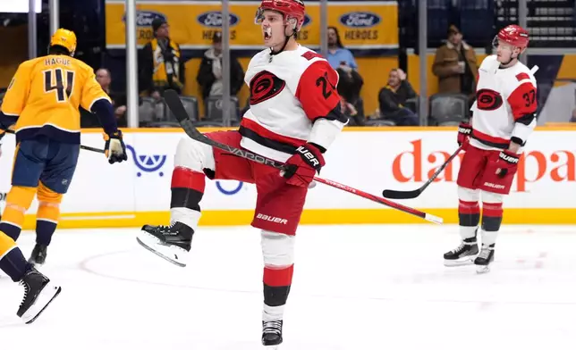 Carolina Hurricanes center Sebastian Aho (20) celebrates his goal during the third period of an NHL hockey game against the Nashville Predators, Wednesday, Dec. 17, 2025, in Nashville, Tenn. (AP Photo/George Walker IV)