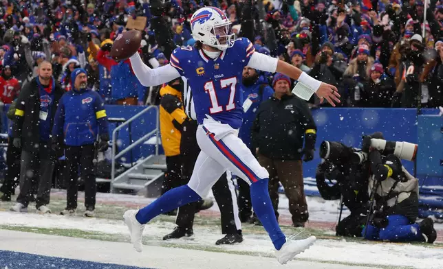 Buffalo Bills quarterback Josh Allen reacts after running for a touchdown against the Cincinnati Bengals during the second half of an NFL football game, Sunday, Dec. 7, 2025, in Orchard Park, N.Y. (AP Photo/Jeffrey T. Barnes)