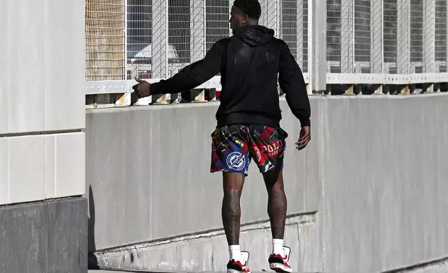 FILE - Miami Heat guard Terry Rozier leaves the U.S. Federal Courthouse through a side door after his arraignment, Oct. 23, 2025, in Orlando, Fla. (AP Photo/Phelan M. Ebenhack, File)
