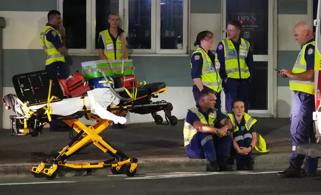 Emergency workers standby at Bondi Beach after a reported shooting in Sydney, Sunday, Dec. 14, 2025. (AP Photo/Mark Baker)