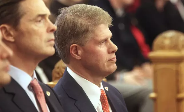 Kansas City Chiefs Chairman and CEO Clark Hunt watches the start of a meeting of legislative leaders who had the power to decide whether the state issues bonds to help the Chiefs finance a new stadium on the Kansas side of the Kansas City metropolitan area, Monday, Dec. 22, 2025, at the Statehouse in Topeka, Kan. (AP Photo/John Hanna)