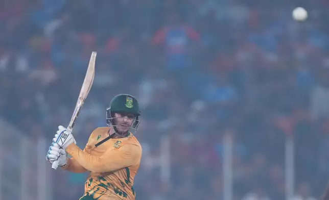 South Africa's Quinton de Kock plays a shot during the fifth T20 cricket match between India and South Africa in Ahmedabad, India, Friday, Dec. 19, 2025. (AP Photo/Ajit Solanki)