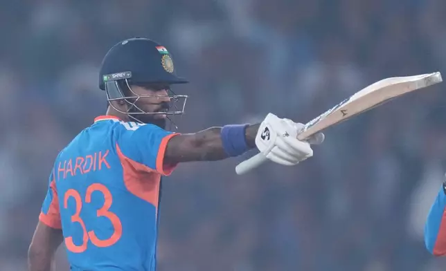 India's Hardik Pandya celebrates after scoring fifty runs during the fifth T20 cricket match between India and South Africa in Ahmedabad, India, Friday, Dec. 19, 2025. (AP Photo/Ajit Solanki)