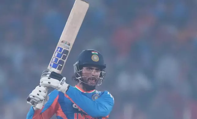 India's Tilak Varma plays a shot during the fifth T20 cricket match between India and South Africa in Ahmedabad, India, Friday, Dec. 19, 2025. (AP Photo/Ajit Solanki)