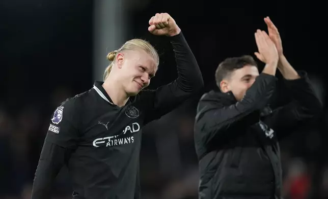 Manchester City's Erling Haaland, reacts after his teams win during the English Premier League soccer match between Fulham and Manchester City in London, Tuesday, Dec. 2, 2025. (AP Photo/Kirsty Wigglesworth)