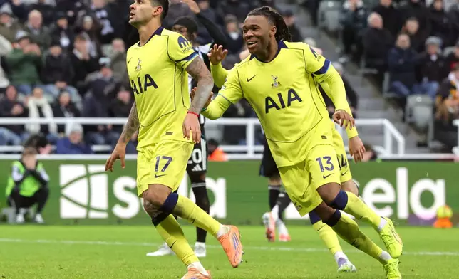 Tottenham Hotspur's Cristian Romero celebrates scoring their side's second goal of the game during the Premier League match at St James' Park, Newcastle on Tuesday Dec. 2, 2025. (Steve Welsh/PA via AP)