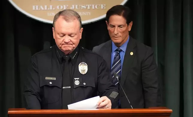 LAPD Chief Jim McDonnell, left, and Los Angeles District Attorney Nathan Hochman announce developments about the murder case of Rob Reiner and his wife Michele Tuesday, Dec. 16, 2025, in Los Angeles. (AP Photo/Damian Dovarganes)