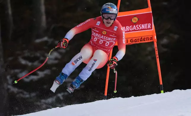 Switzerland's Marco Odermatt speeds down the course during an alpine ski, men's World Cup downhill, in Val Gardena, Italy, Thursday, Dec. 18, 2025. (AP Photo/Luciano Bisi)