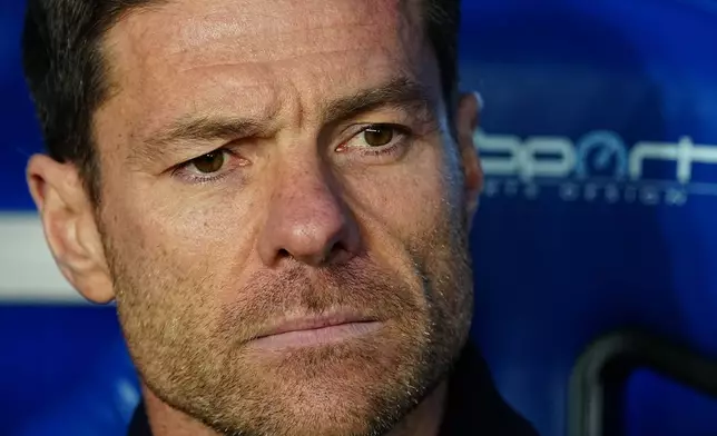 Real Madrid's head coach Xabi Alonso waits for the start of the Spanish La Liga soccer match between Alaves and Real Madrid in Vitoria-Gasteiz, Spain, Sunday, Dec. 14, 2025. (AP Photo/Miguel Oses)