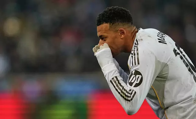 Real Madrid's Kylian Mbappe celebrates after scoring the opening goal during the Spanish La Liga soccer match between Alaves and Real Madrid in Vitoria-Gasteiz, Spain, Sunday, Dec. 14, 2025. (AP Photo/Miguel Oses)