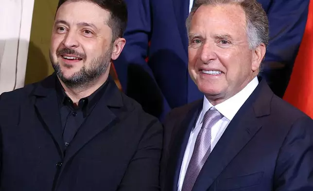 Ukraine's President Volodymyr Zelenskyy and U.S. Special Envoy Steve Witkoff gather for a family photo at the Chancellery in Berlin, Monday, Dec. 15, 2025. (Lisi Niesner/Pool Photo via AP)