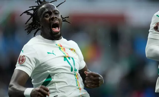 Senegal's Cherif Ndiaye celebrates after scoring during the Africa Cup of Nations group D soccer match between Senegal and Botswana in Tangier, Morocco, Tuesday, Dec. 23, 2025. (AP Photo/Mosa'ab Elshamy)