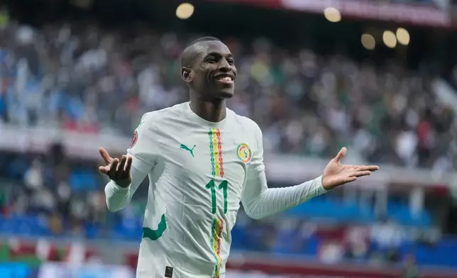 Senegal's Nicolas Jackson celebrates after scoring during the Africa Cup of Nations group D soccer match between Senegal and Botswana in Tangier, Morocco, Tuesday, Dec. 23, 2025. (AP Photo/Mosa'ab Elshamy)