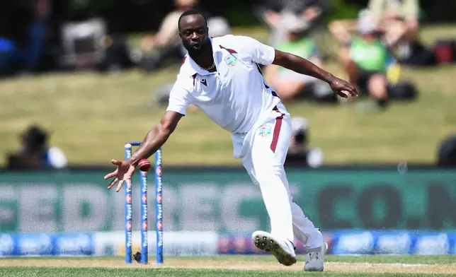 West Indies' Kemar Roach fields against New Zealand during their cricket test match in Christchurch, New Zealand, Thursday, Dec. 4, 2025. (Chris Symes/Photosport via AP)