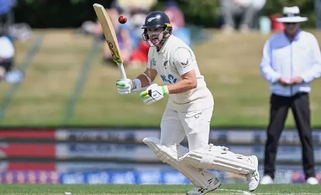 New Zealand's Tom Latham bats against the West Indies on day 3 during their cricket test match in Christchurch, New Zealand, Thursday, Dec. 4, 2025. (Andrew Cornaga/Photosport via AP)