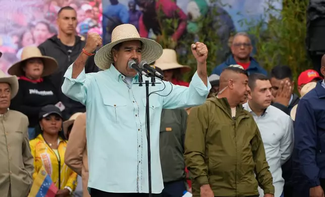 President Nicolas Maduro speaks during a rally marking the anniversary of the Battle of Santa Isabel, which took place during Venezuela's 19th-century Federal War, in Caracas, Venezuela, Wednesday, Dec. 10, 2025. (AP Photo/Ariana Cubillos)