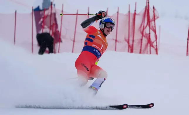 Switzerland's Marco Odermatt reacts at the finish line during a World Cup men's giant slalom skiing race, Sunday, Dec. 7, 2025, in Beaver Creek, Colo. (AP Photo/John Locher)