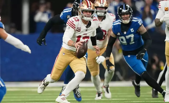 San Francisco 49ers quarterback Brock Purdy (13) runs against the Indianapolis Colts during the first half of an NFL football game, Monday, Dec. 22, 2025, in Indianapolis. (AP Photo/Carolyn Kaster)
