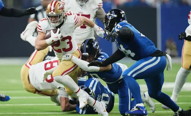 San Francisco 49ers running back Christian McCaffrey (23) runs against the Indianapolis Colts during the first half of an NFL football game, Monday, Dec. 22, 2025, in Indianapolis. (AP Photo/AJ Mast)