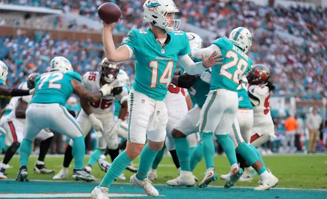 Miami Dolphins quarterback Quinn Ewers (14) looks to pass against the Tampa Bay Buccaneers during the second half of an NFL football game Sunday, Dec. 28, 2025, in Miami Gardens, Fla. (AP Photo/Lynne Sladky)