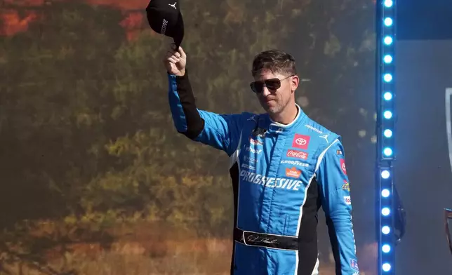 FILE - Denny Hamlin is introduced before a NASCAR Cup Series auto race Sunday, Nov. 2, 2025, in Avondale, Ariz. (AP Photo/Rick Scuteri, File)