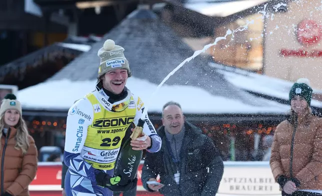 Czech Republic's Jan Zabystran celebrates winning an alpine ski, men's World Cup super-G, in Val Gardena, France, Friday, Dec.19, 2025. (AP Photo/Alessandro Trovati)