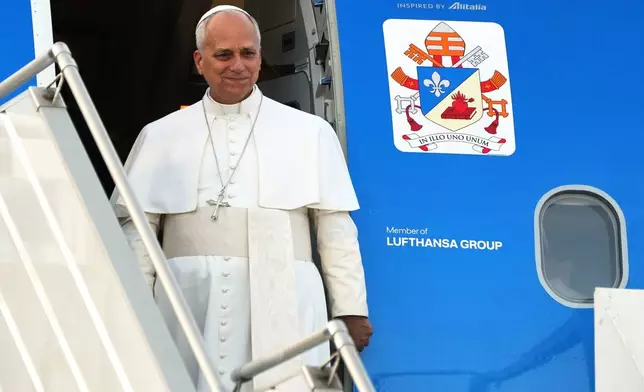 Pope Leo XIV arrives at Beirut's international airport, Lebanon, Sunday, Nov. 30, 2025. (AP Photo/Domenico Stinellis)